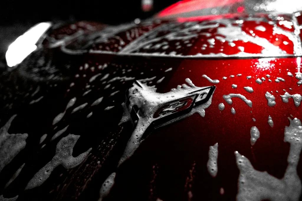 Polished bodywork atmosphere for vehicle-care context, not a before-and-after or completed-work claim.