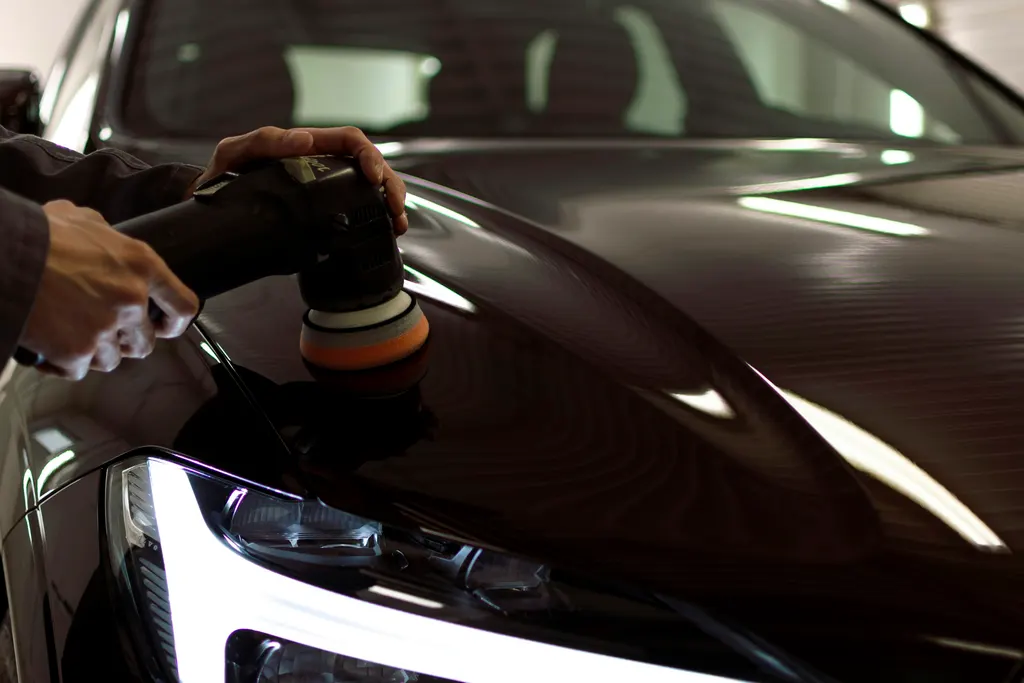High-gloss paint reflection used as protection-studio atmosphere, not a customer vehicle in the Joker Auto Detailing portfolio.