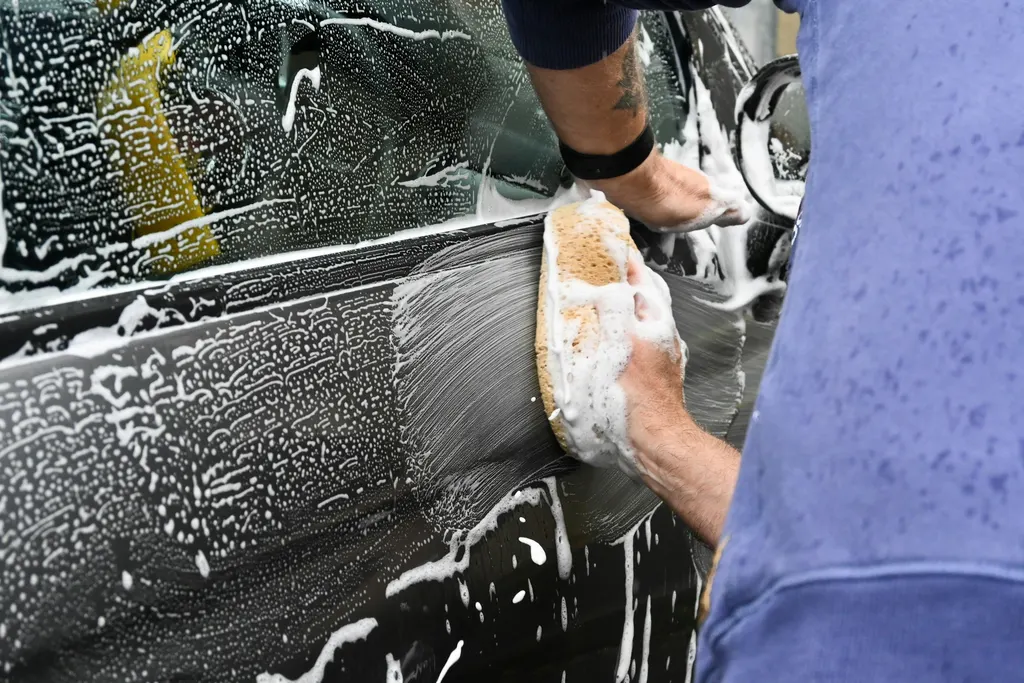 Exterior vehicle detailing atmosphere showing clean bodywork, not a roadside wash or a labelled customer car.