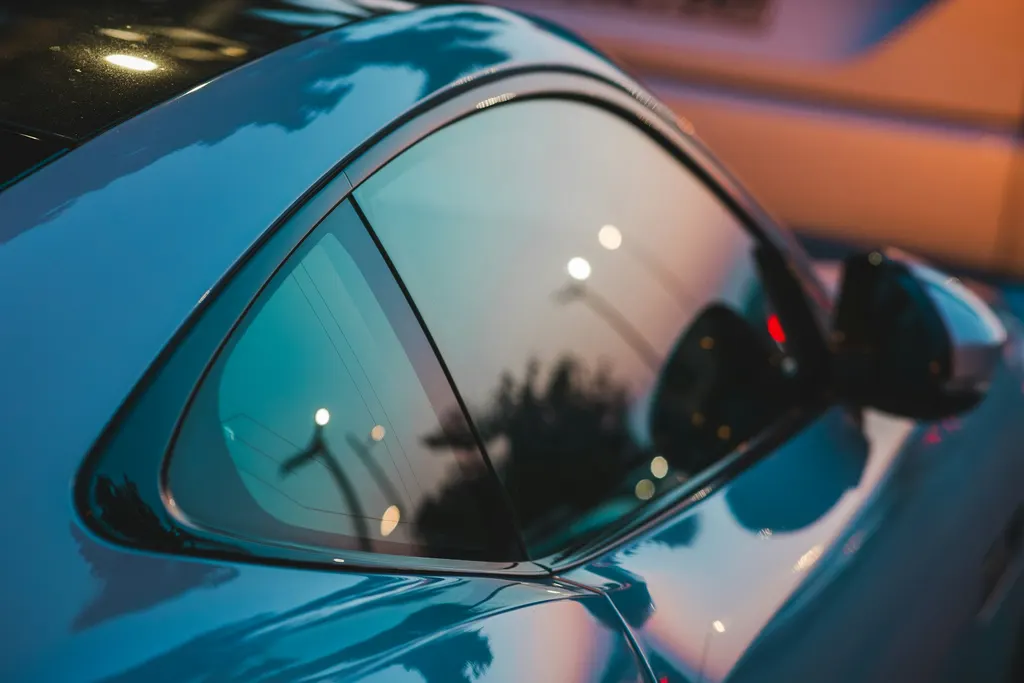 Visual atmosphere of polished vehicle paint reflections supporting paint-enhancement context, not a labelled customer result.