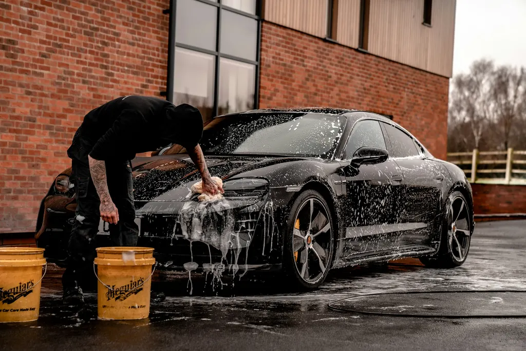 Premium car-care atmosphere for maintenance detailing context, not a cheap wash or roadside valet scene labelled as this company.